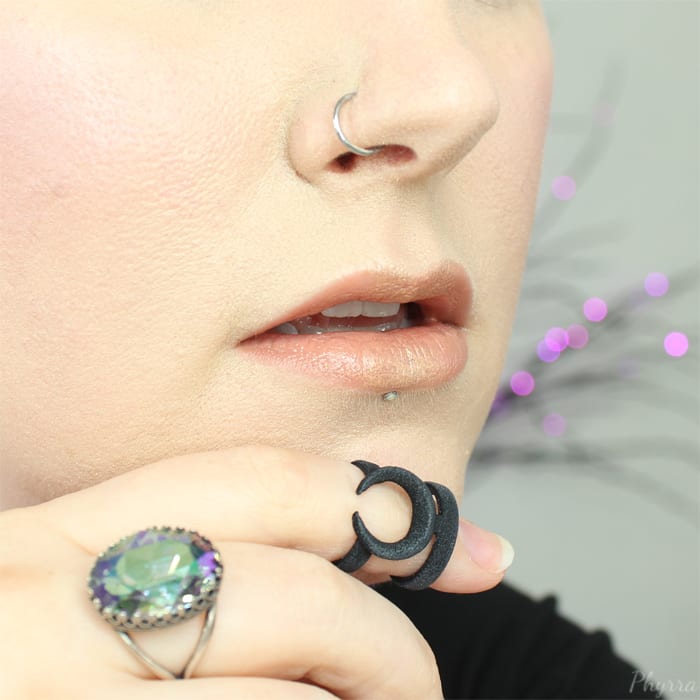 Wearing Urban Decay Naked 2 and Interstellar pressed at the center of the lips