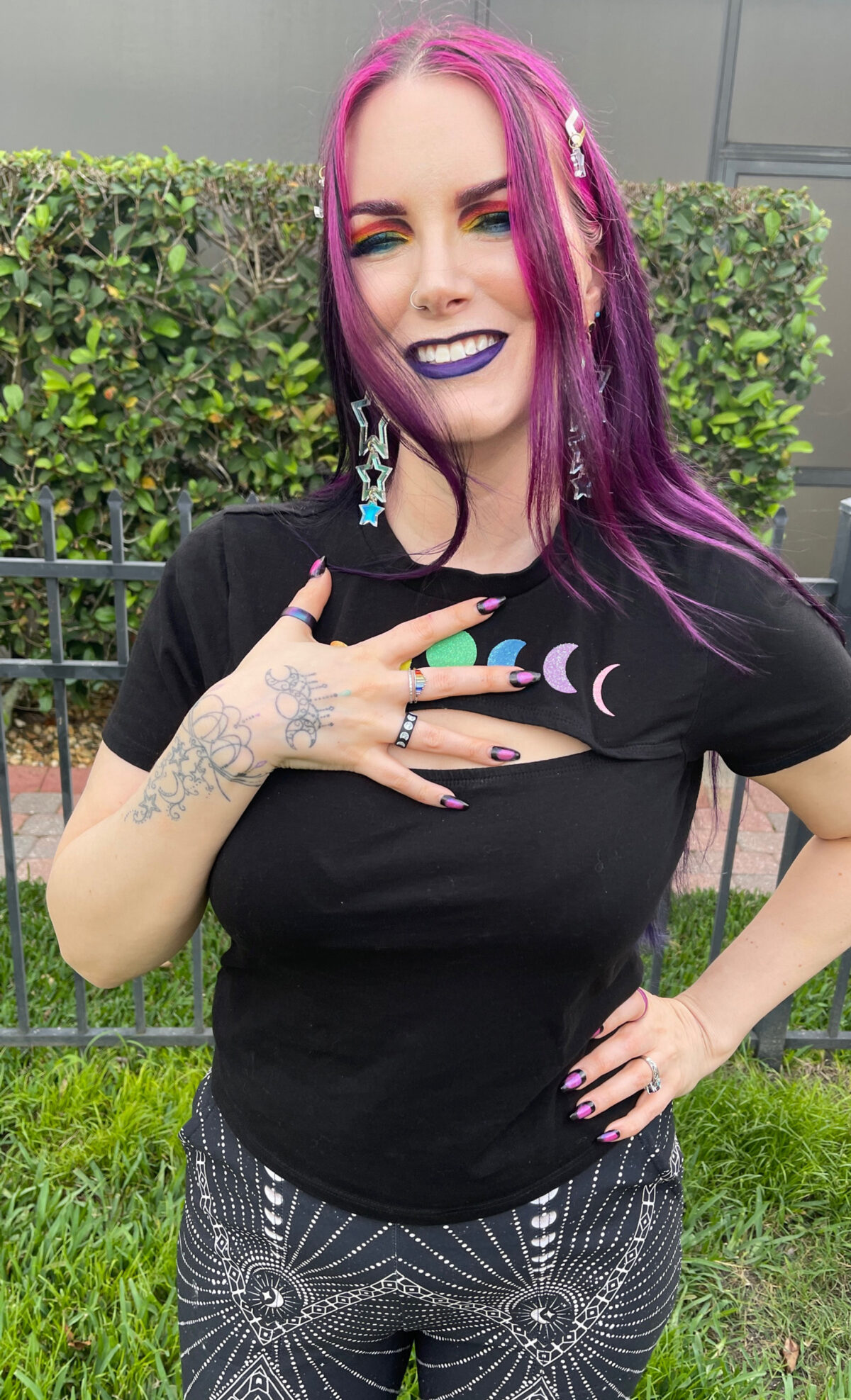 Queer Pride ring on a queer woman