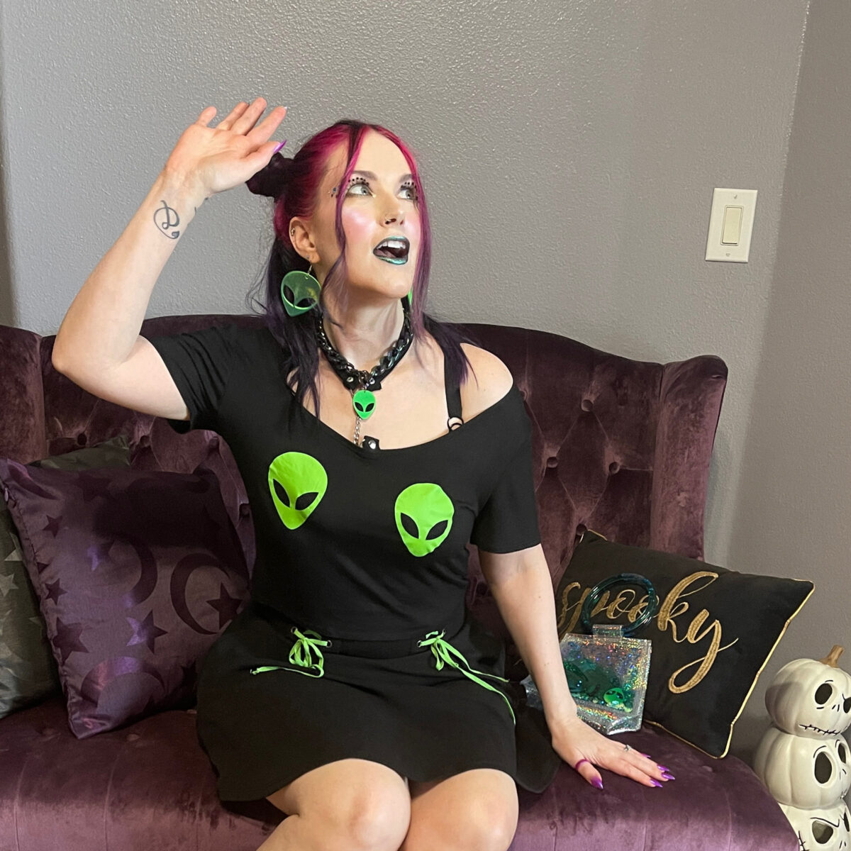 Cordelia is posed as if she is being abducted by aliens