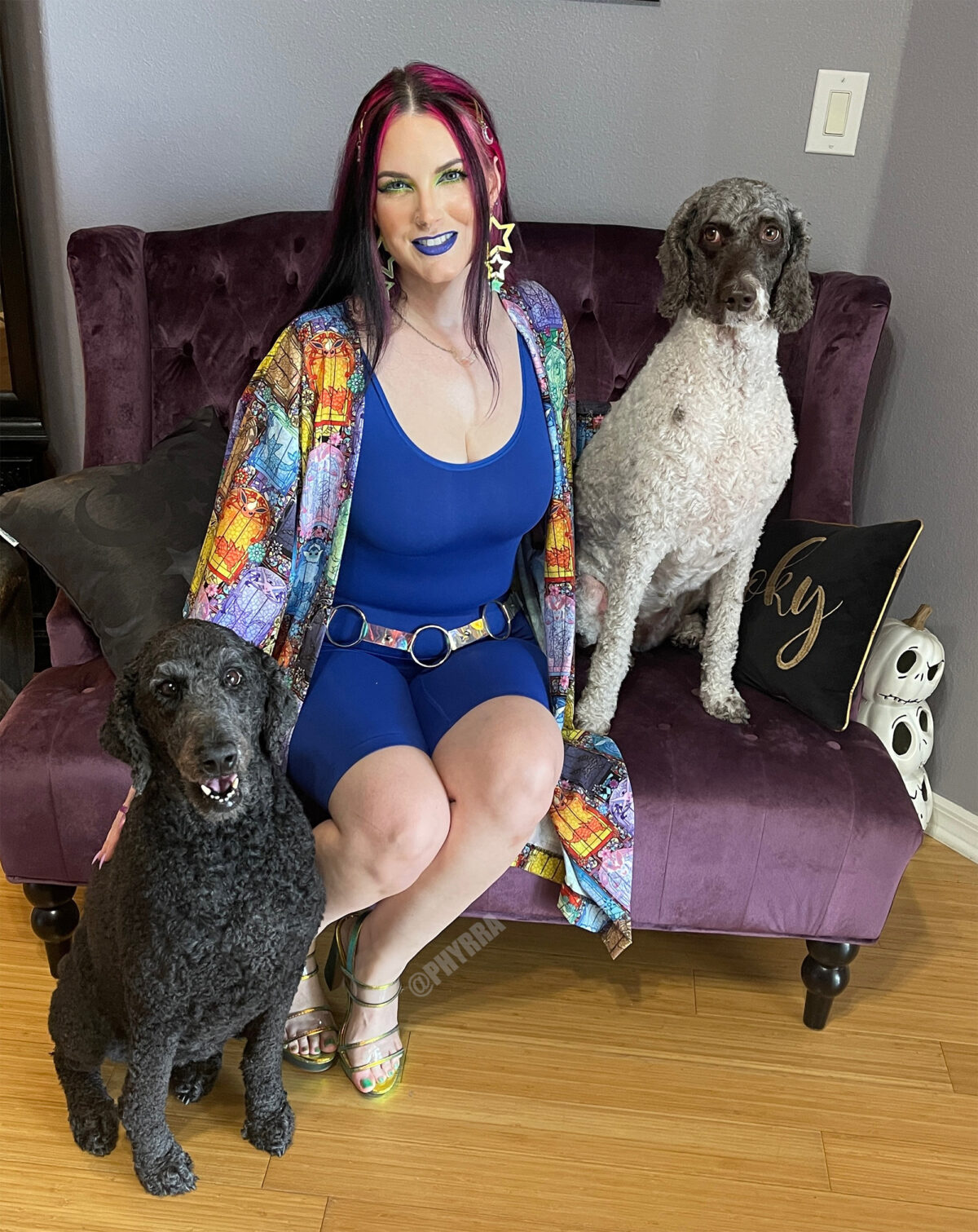 Nyx, Cordelia, Amaya together on a purple sofa