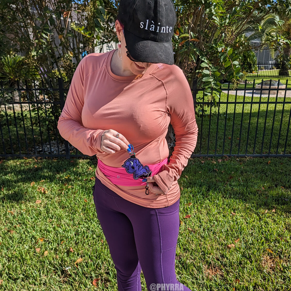 Cordelia demonstrates pulling out her large Tokidoki unicorno key fob from her flipbelt