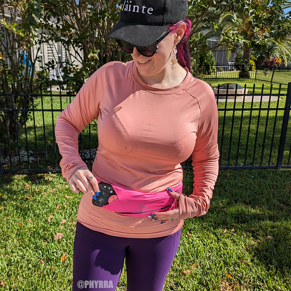 Cordelia demonstrates pulling her iPhone 12 Pro Max out of the flipbelt